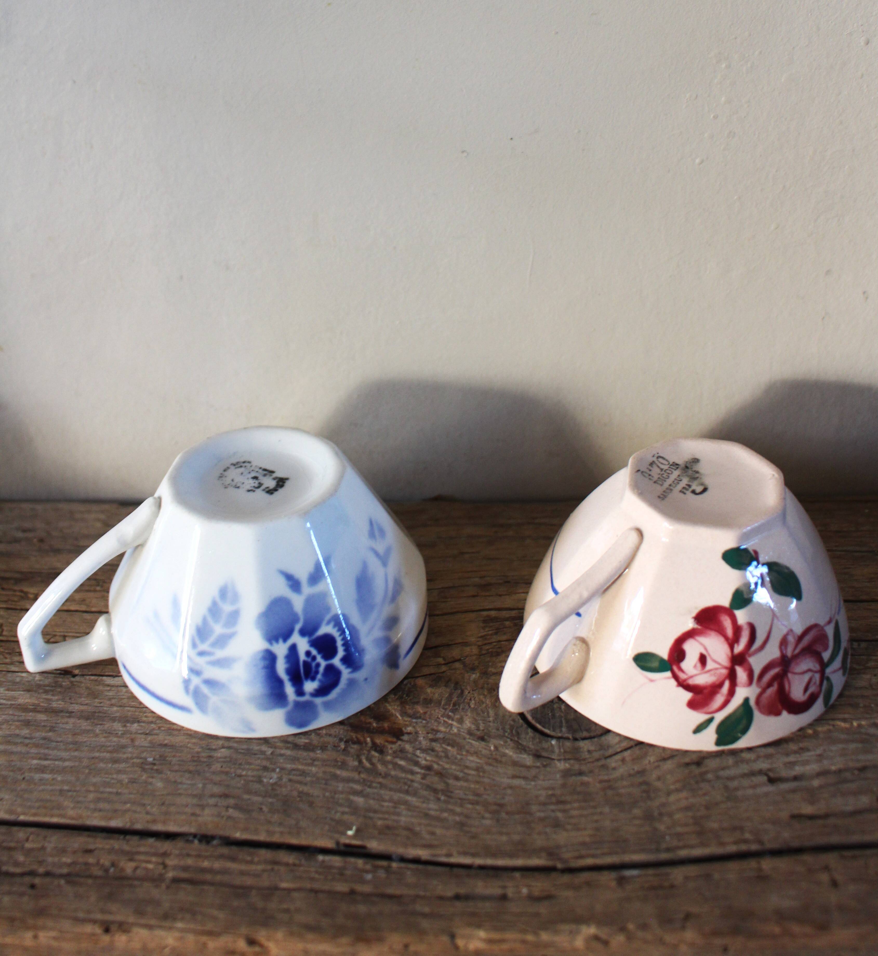 A set of 2 Digoin Sarreguemines cups with pink and blue flowers.