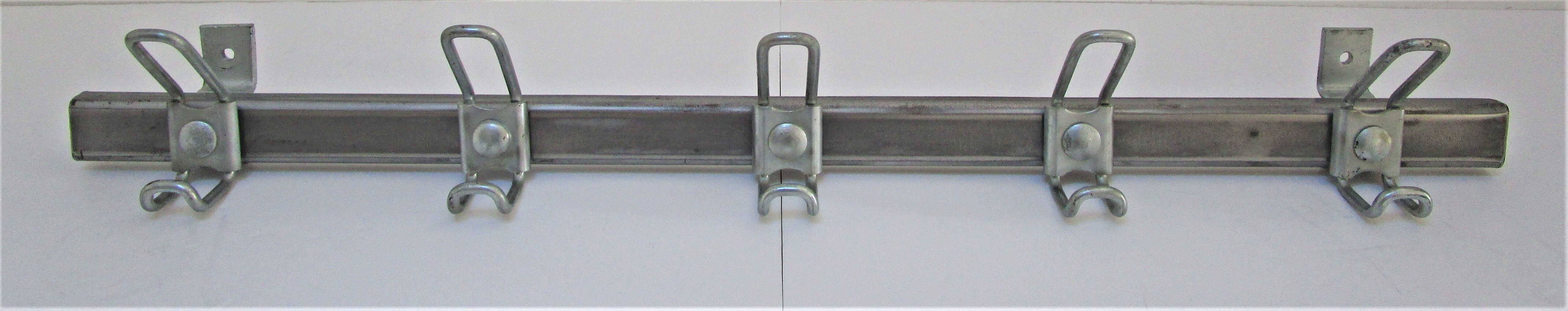 Vintage school wall rack in patinated steel