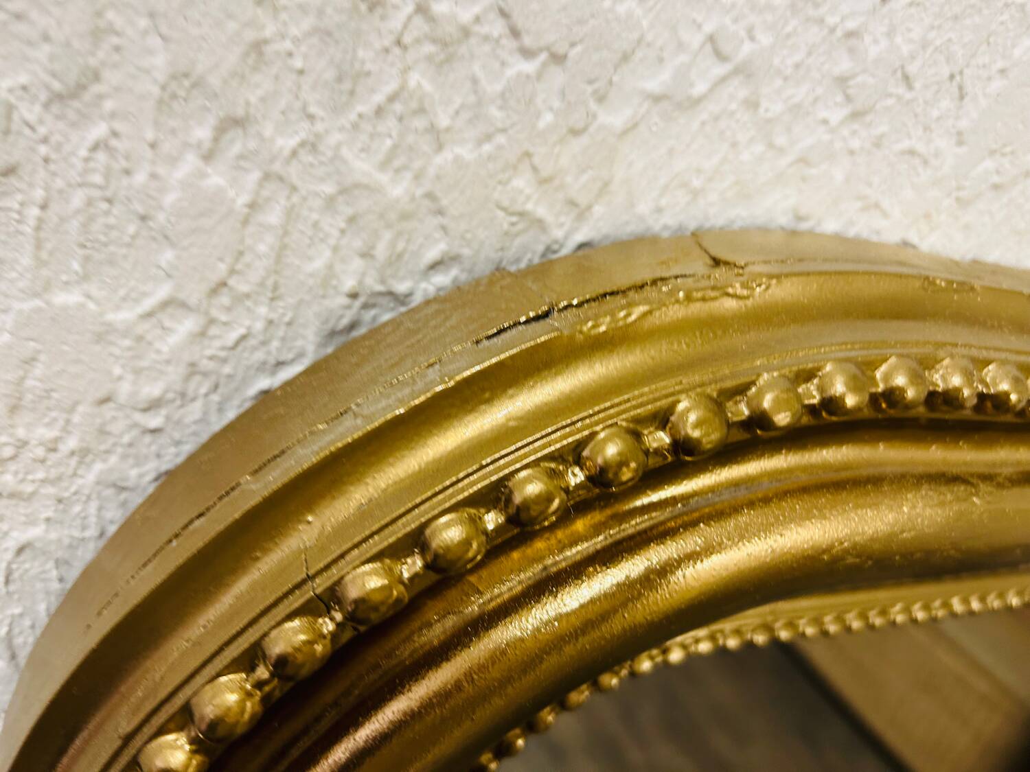 Antique gilded mirror in old Louis Philippe wood