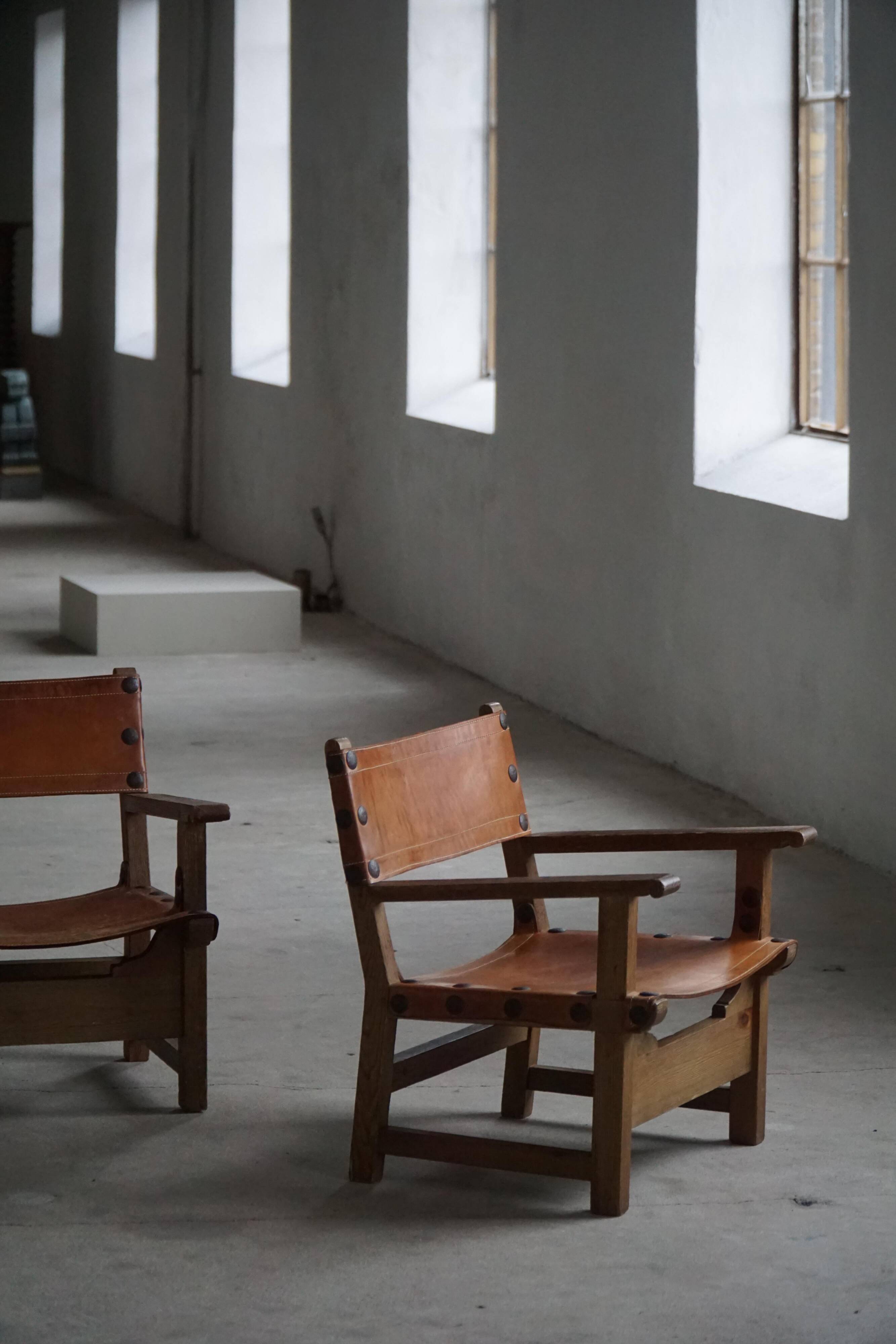 Pair of Spanish brutalist armchairs from the 1960s, wood and leather.