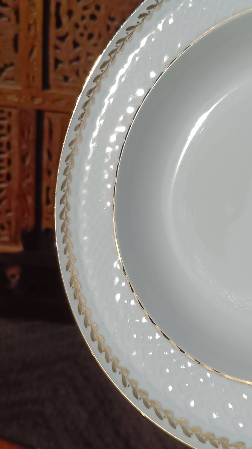 Twelve white porcelain plates
