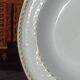 Twelve white porcelain plates