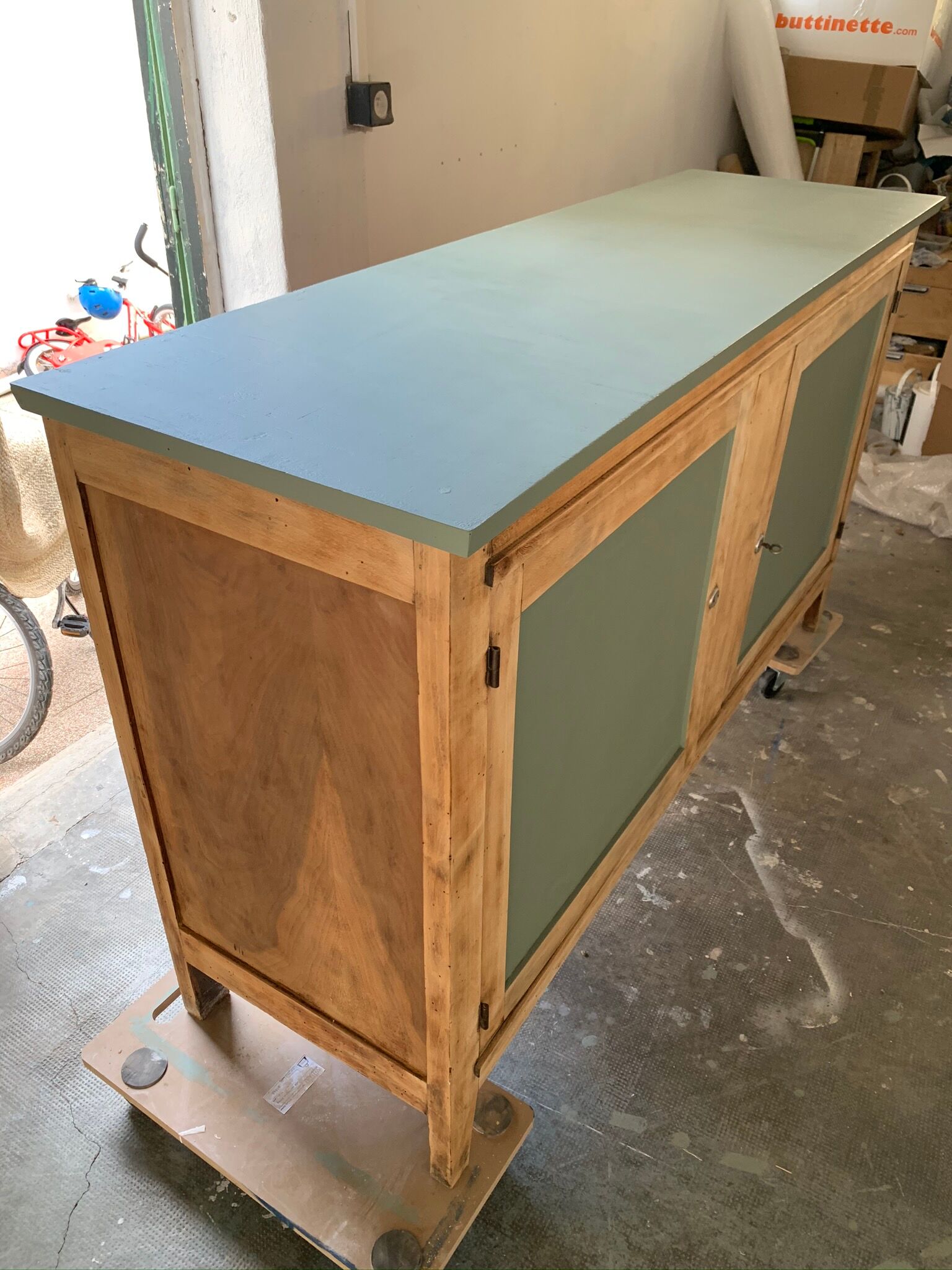 Green buffet and raw wood