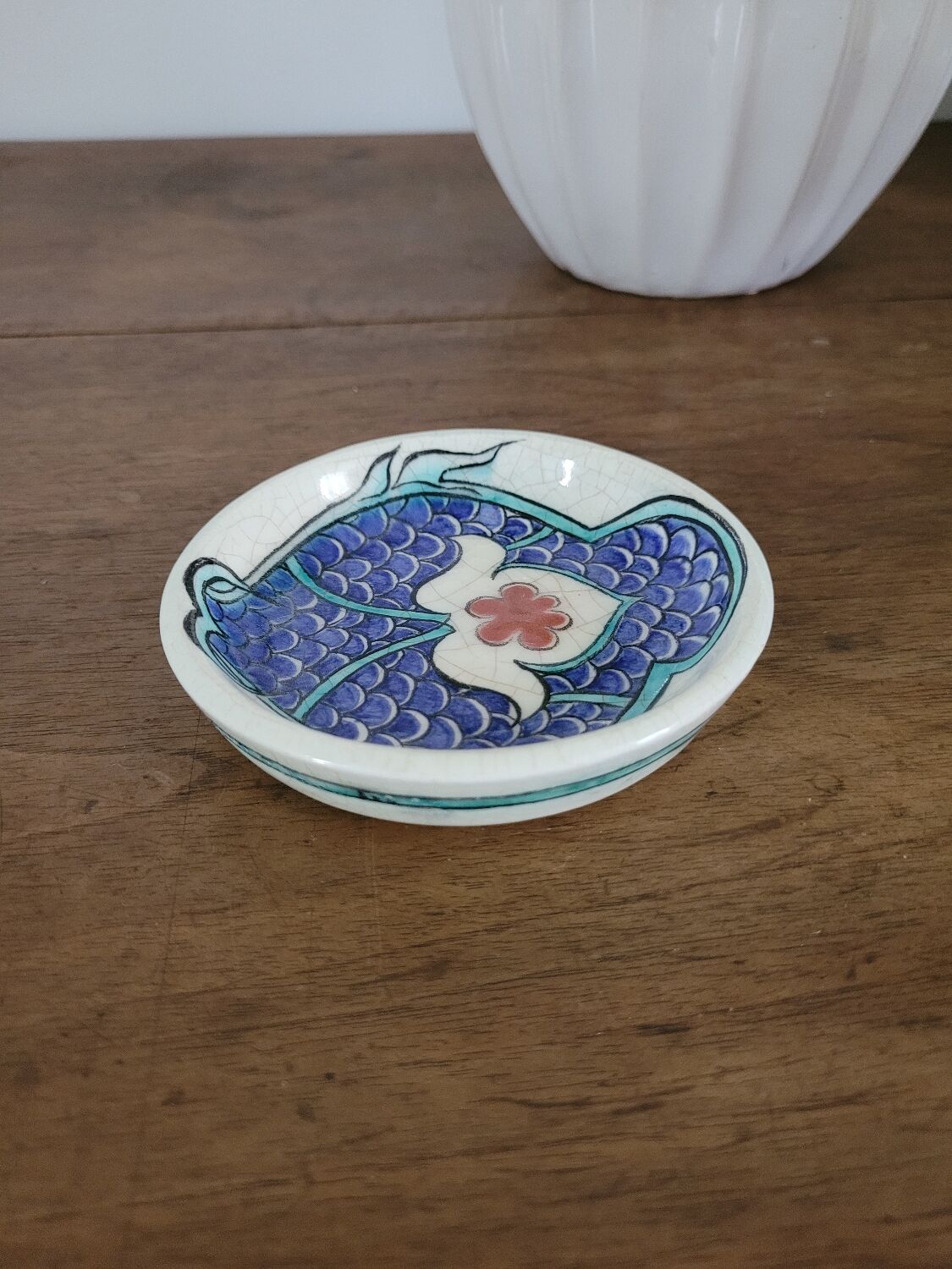Small glazed stoneware bowl with a fish design