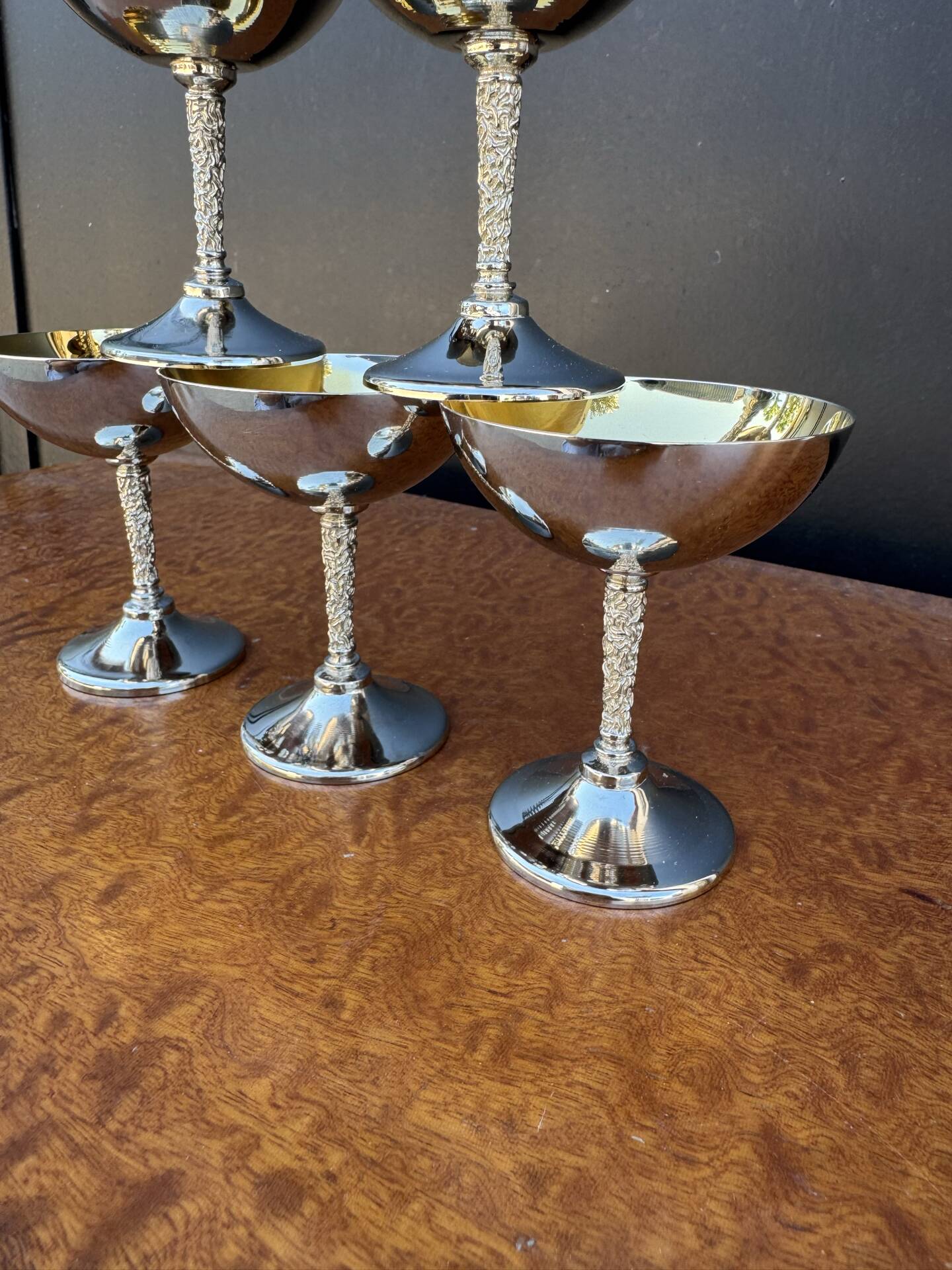 Silver-plated metal wine glasses on stems from the 1970s.
