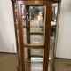 Wooden display case and half-moon mirror