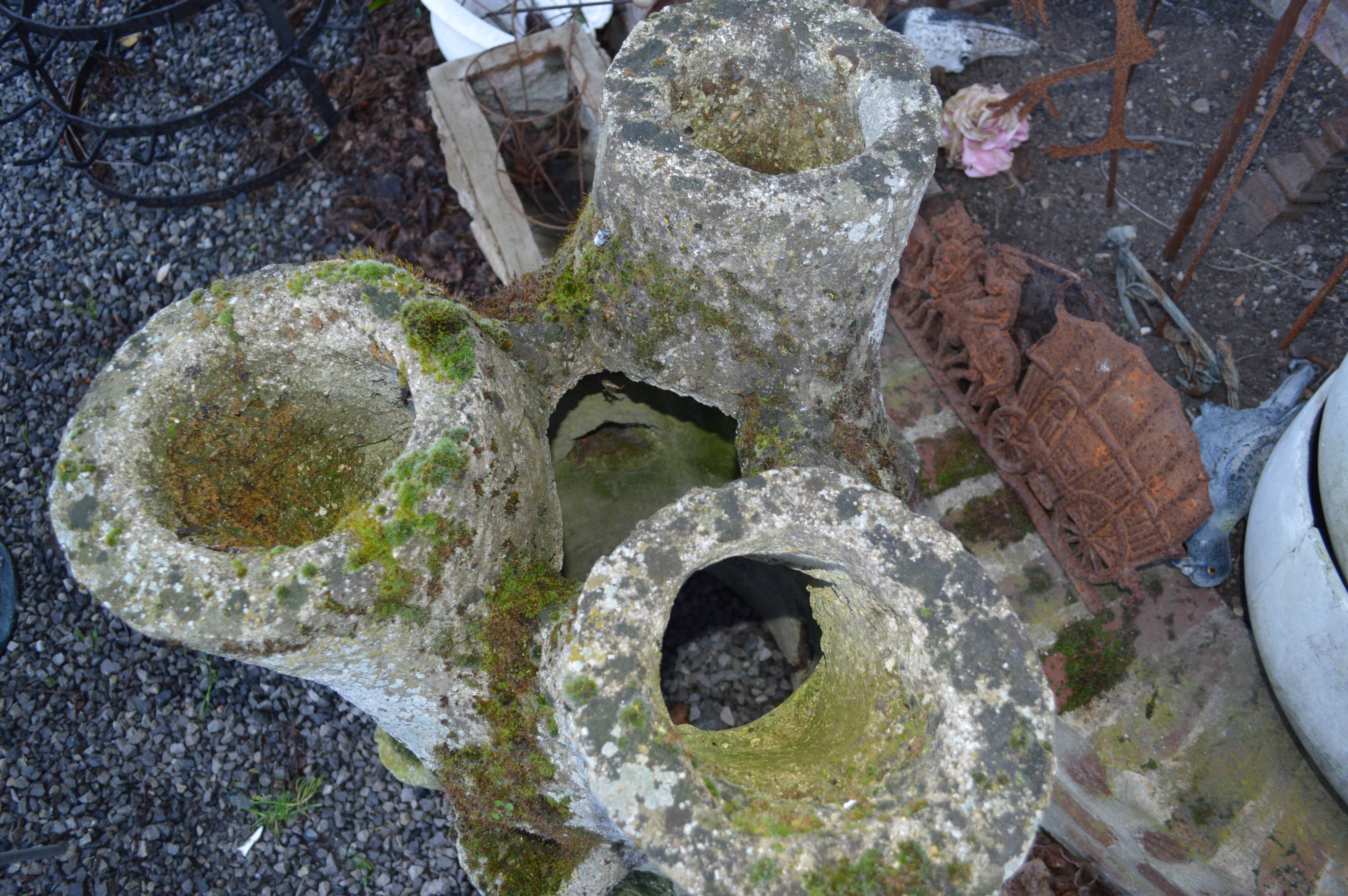 Concrete tree trunk planter