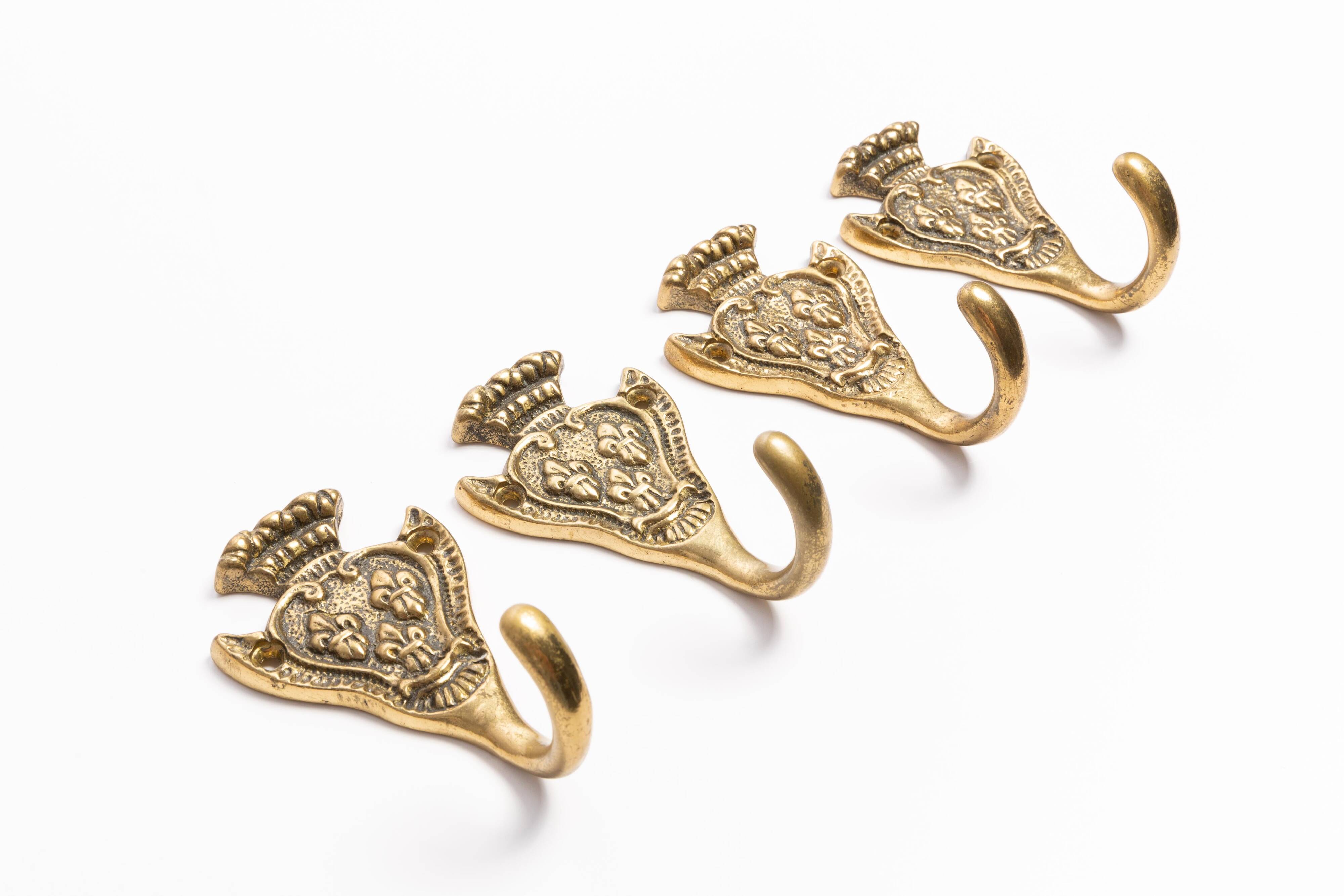 Set of four decorative vintage gold wall hooks, Europe, 1960s.
