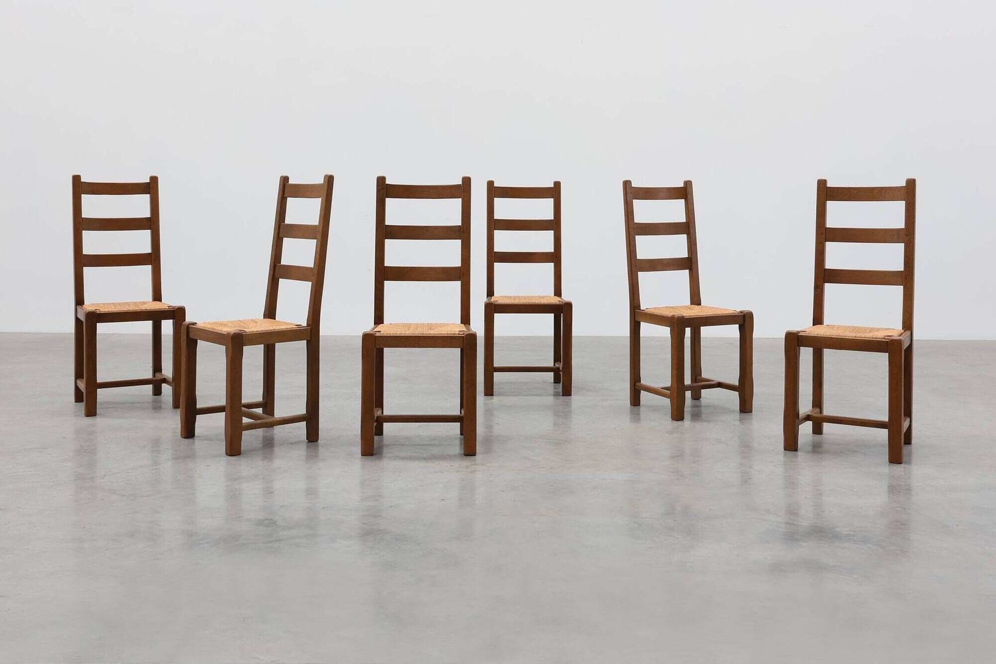 Set of 6 rustic oak ladder-back chairs with rush seats, France, 20th centur