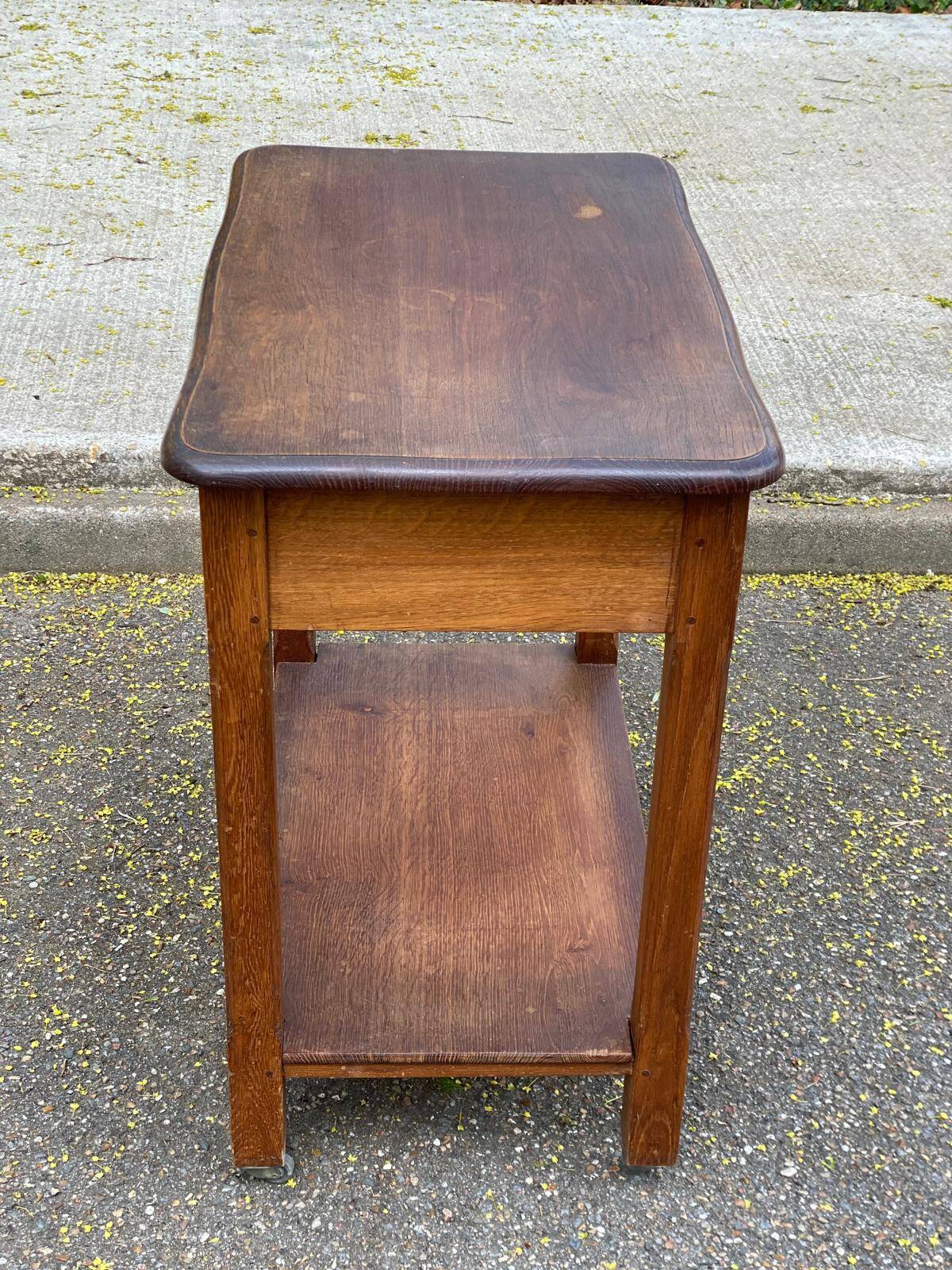 Vintage farmhouse dessert trolley on wheels made of solid wood from the 19th century.