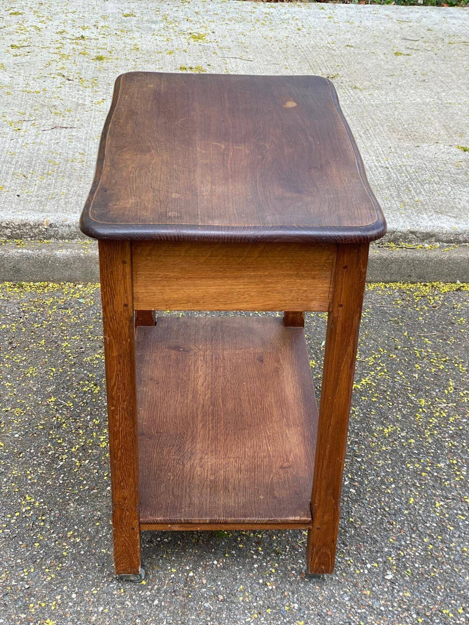 Vintage farmhouse dessert trolley on wheels made of solid wood from the 19th century.