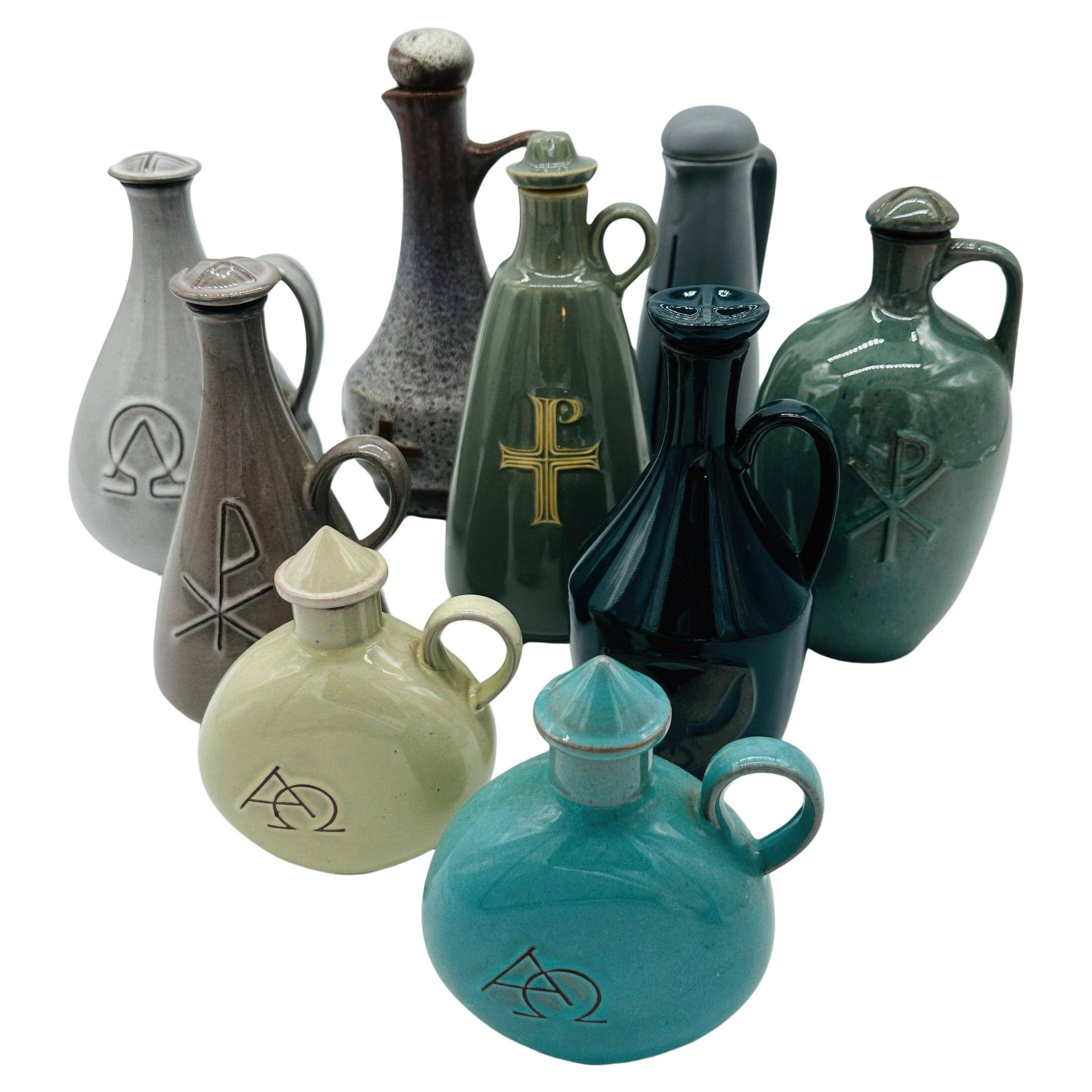 Set of nine modern sculptural ceramic vases from the mid-century, Bauhaus influence.