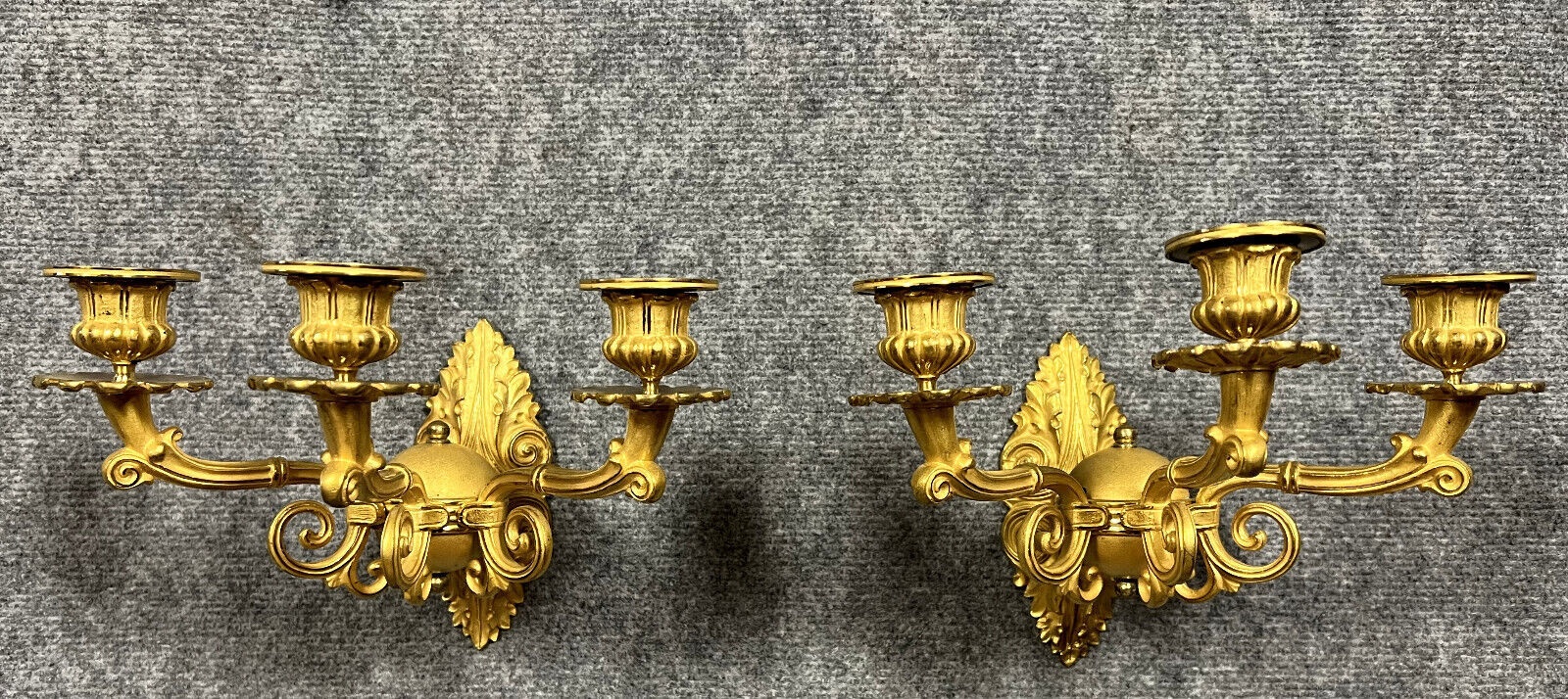 Pair of sconces period Consulate (18th) in gilded bronze with two patinas