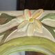 Carved wooden mirror, colourful floral decoration.