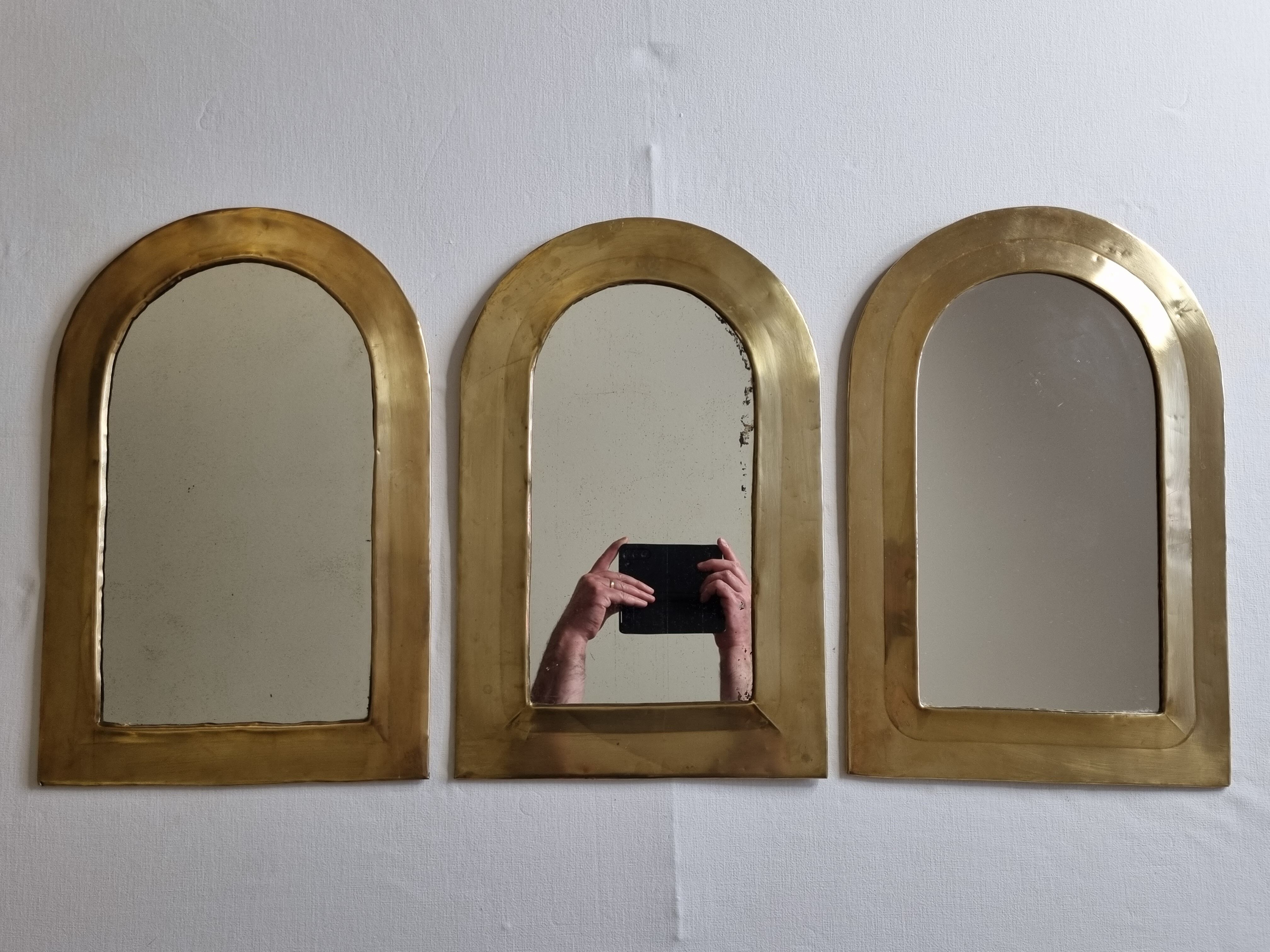 Set of three Moroccan brass mirrors in the form of arches, 43 cm