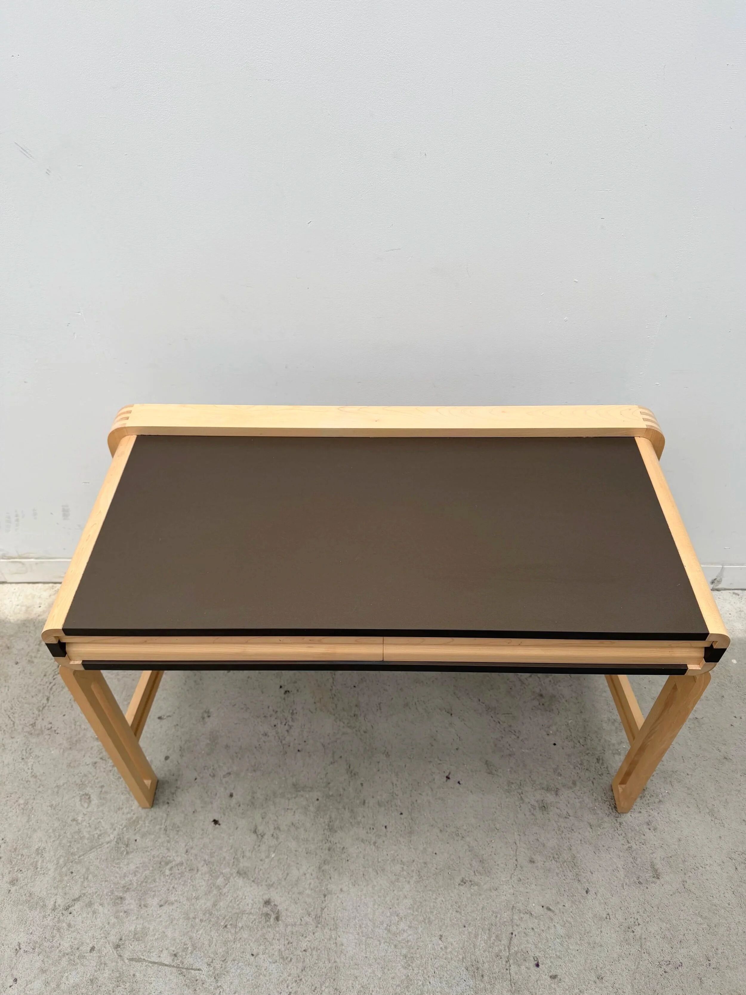 Solid wood and formica desk made by a cabinetmaker.