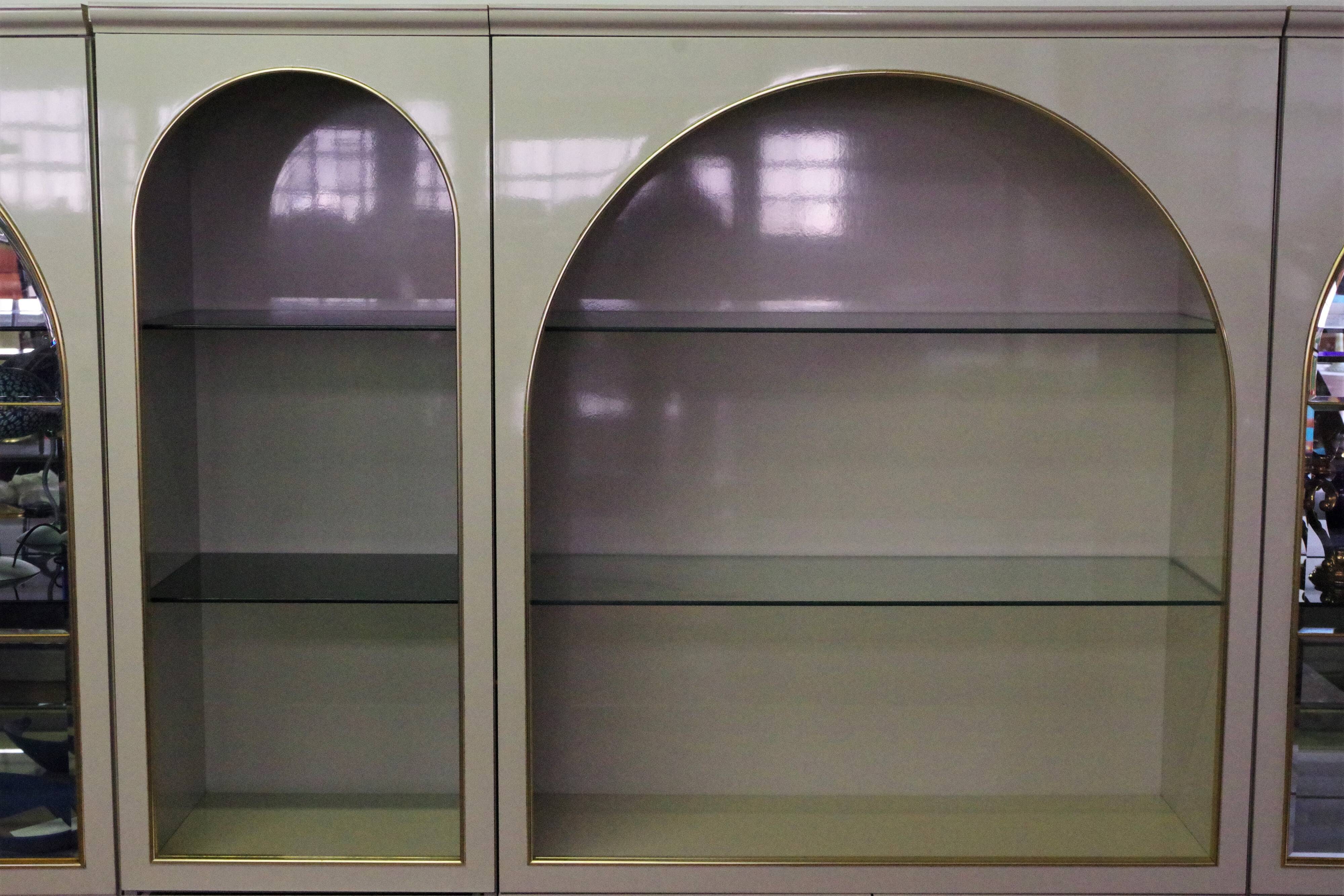 Showcases in lacquered wood, glass and brass  1970s, set of 4