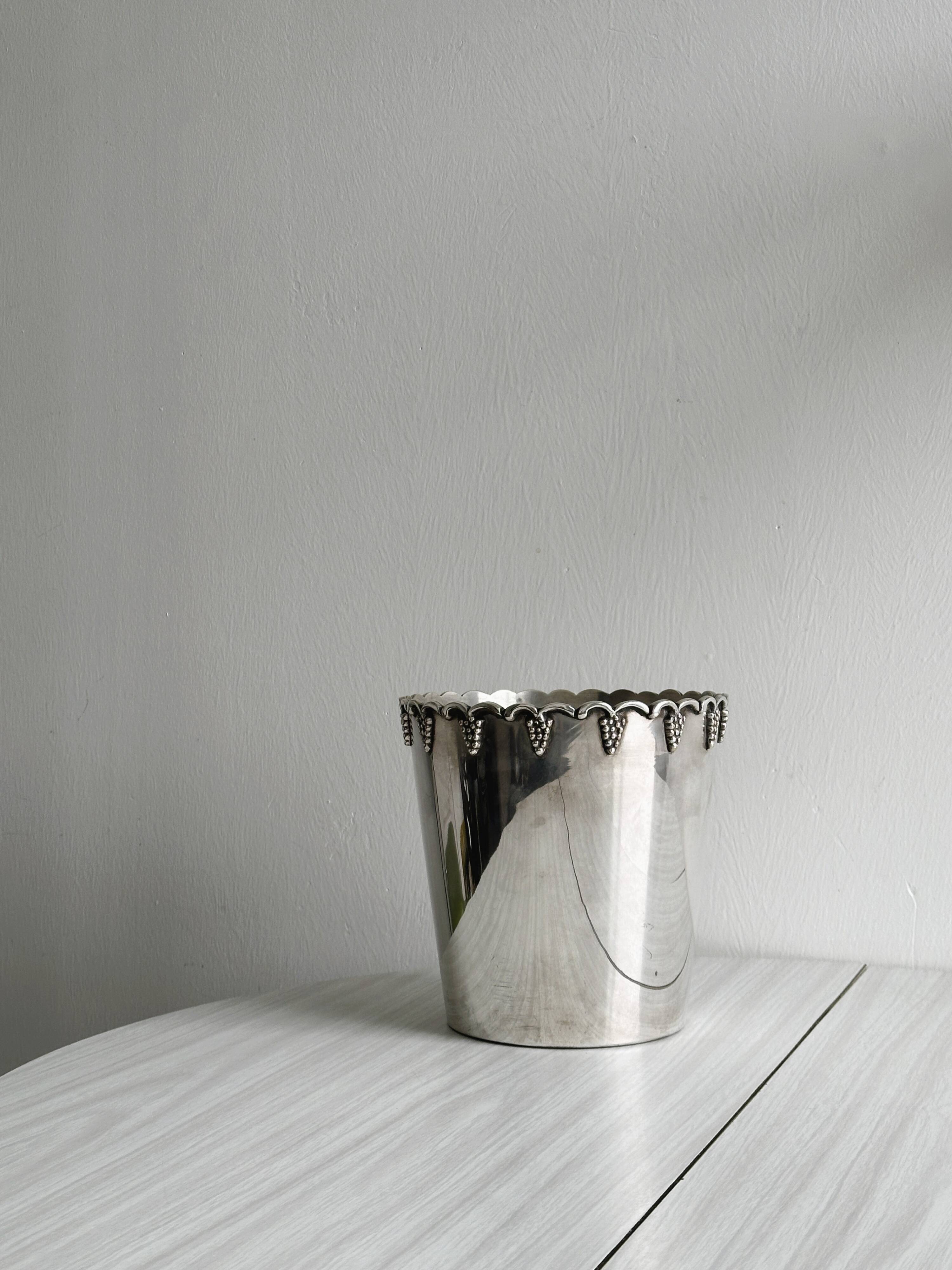 Antique champagne bucket in shiny silver metal