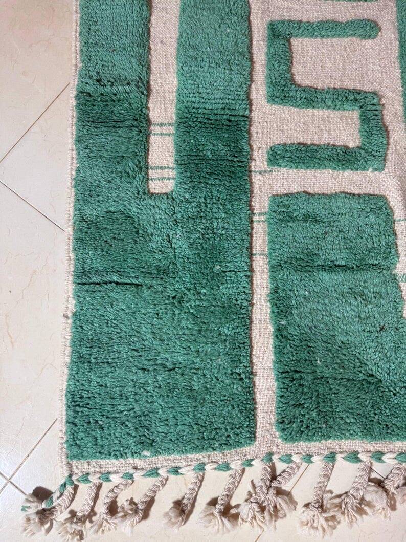 Beni Ourain Berber rug made of natural wool, traditionally handwoven.