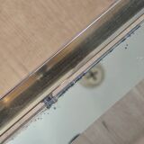 Vintage coffee table with glass, mirror, and brass.