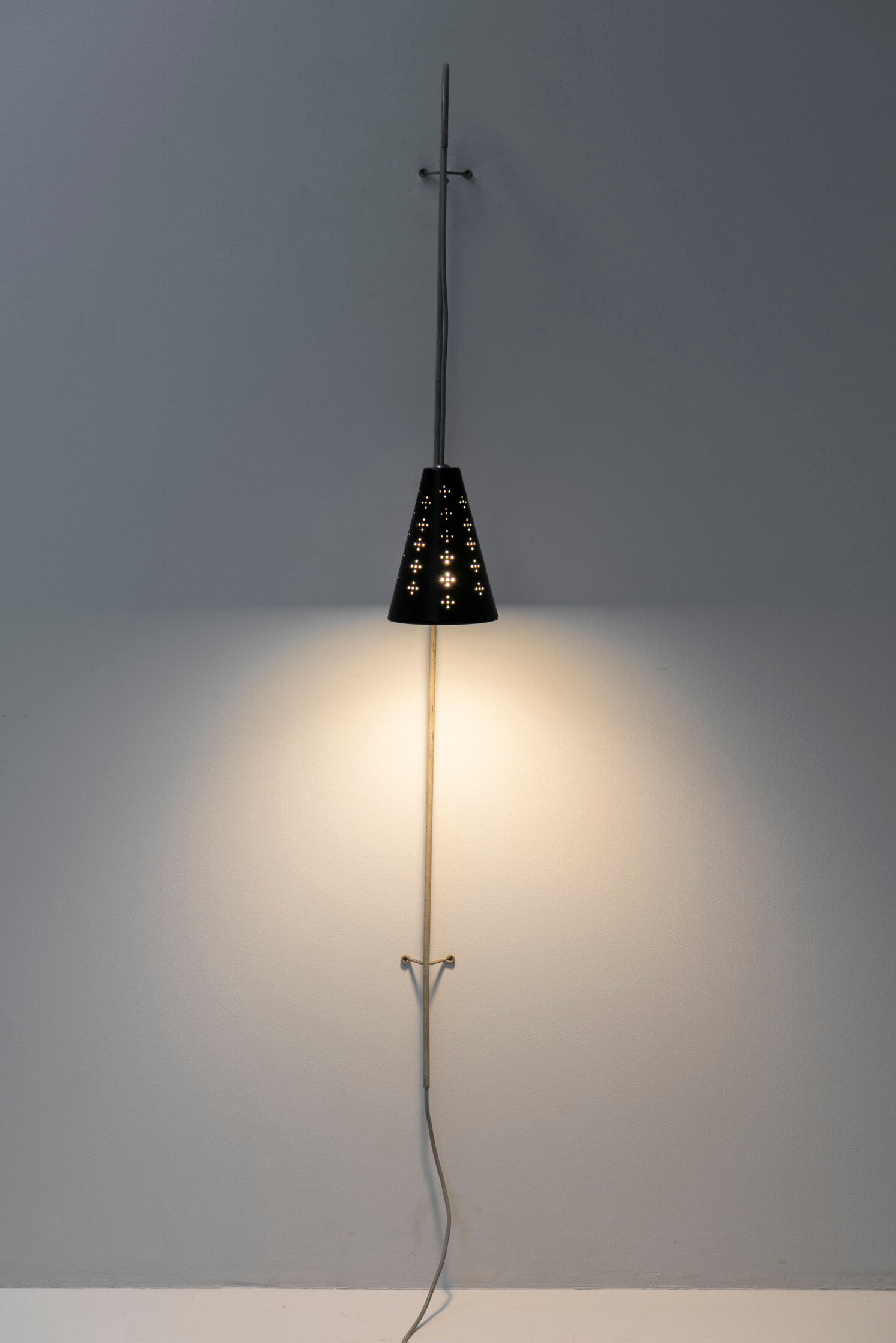 Hanging wall lamp with black perforated cap, 1960's