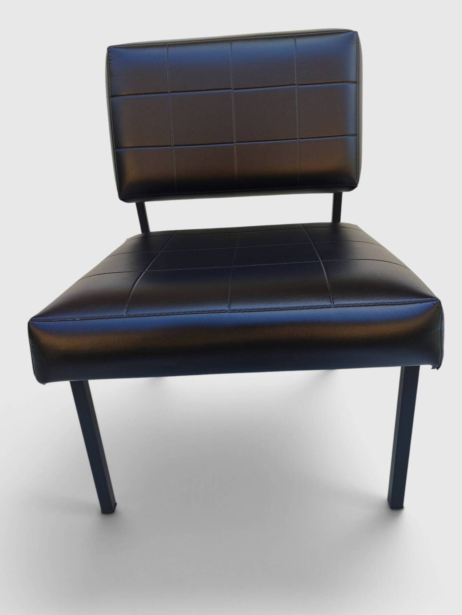 Modernist armchair in black faux leather and metal – 1960s