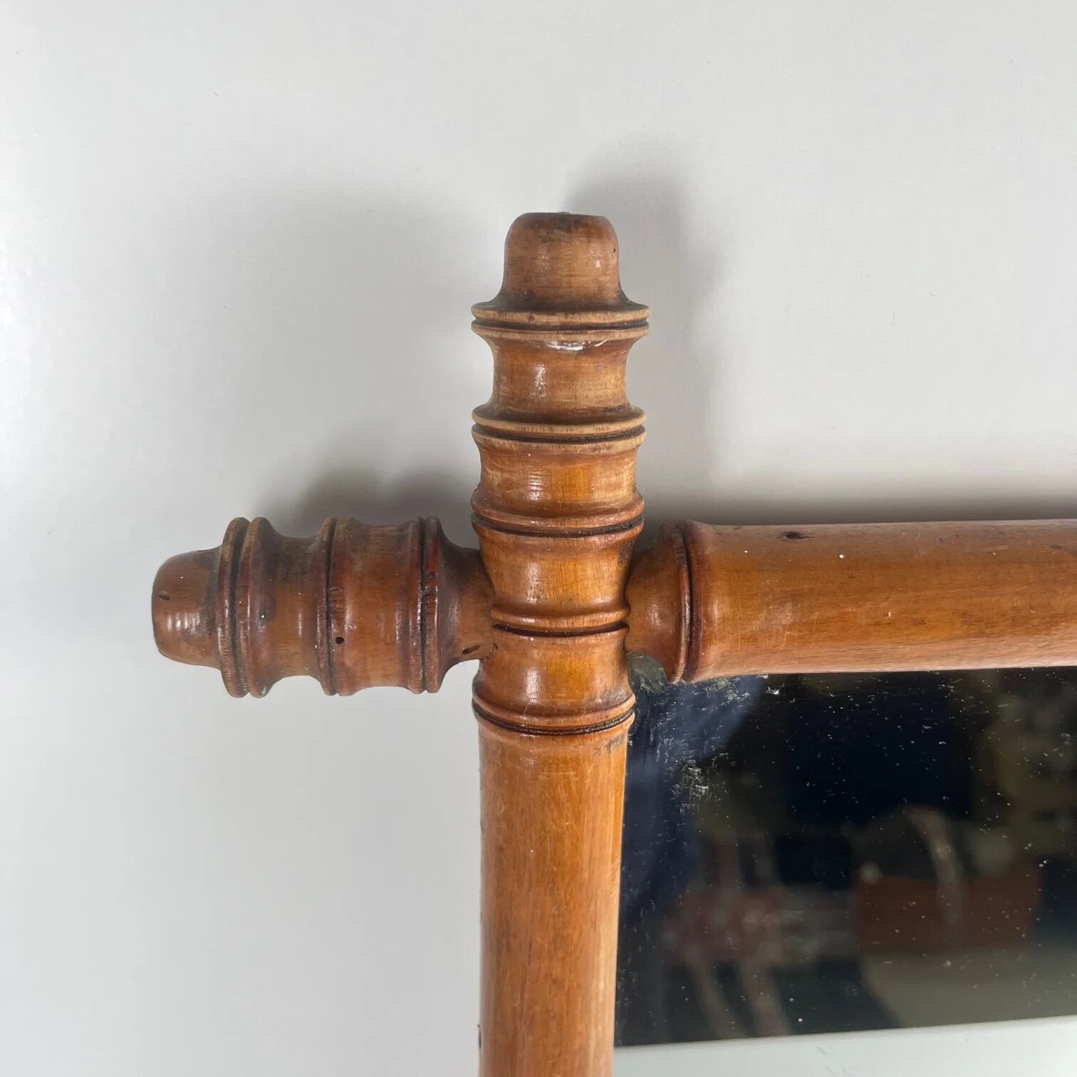 Wooden turned mirror in bamboo style, circa 1900-1930.