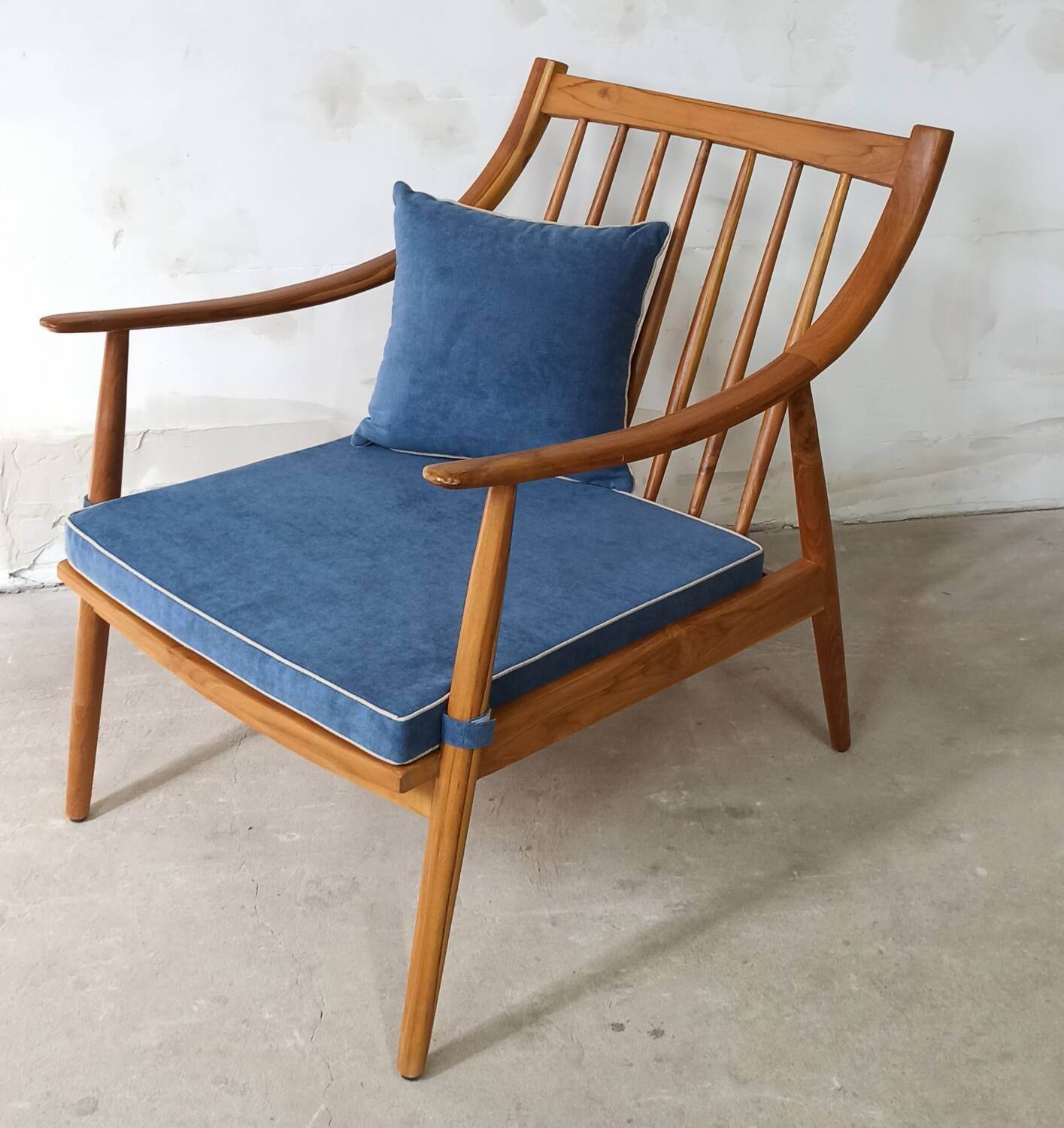 Pair of cozy teak armchairs with cushions