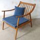 Pair of cozy teak armchairs with cushions