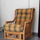 Vintage armchair in bamboo and rattan with a tartan pattern.