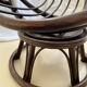 Chaise à œuf en rotin vintage des années 70 en très bon état.
