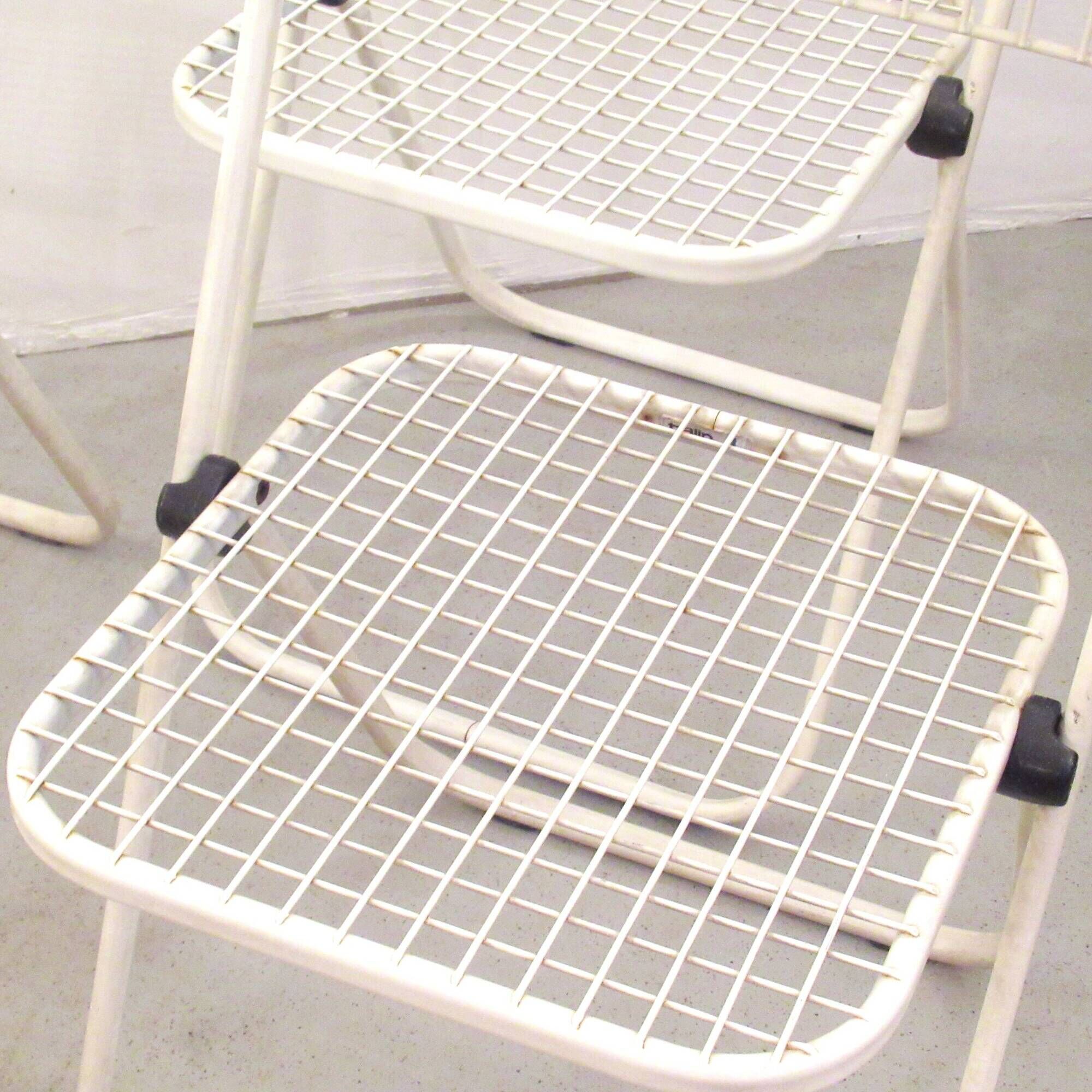 Four Talin Spa metal mesh chairs from the 1980s.