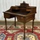 Louis XVI style desk from the late 19th century in walnut with a leather top.