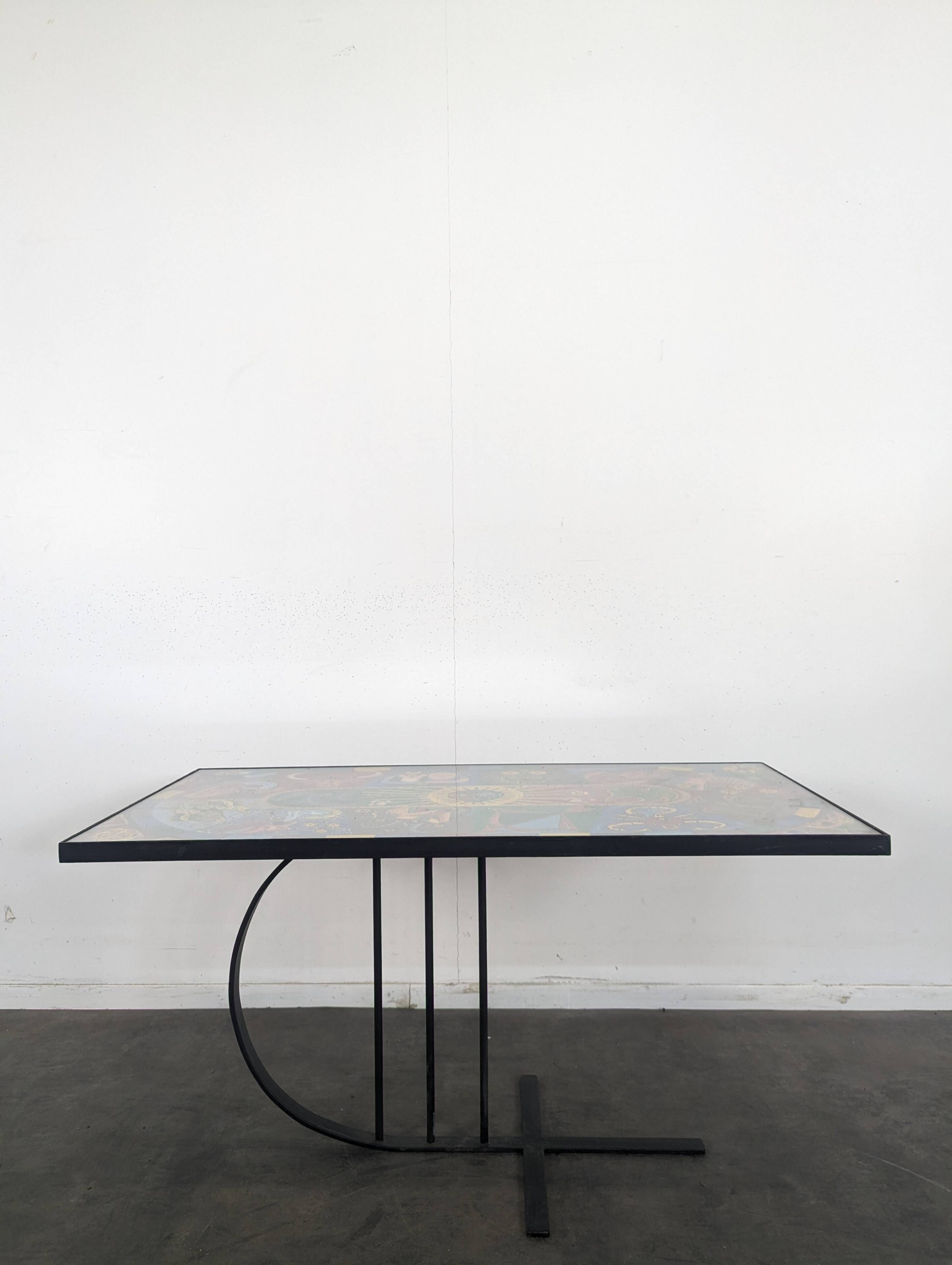 Chrome steel coffee table with zodiac signs decoration.