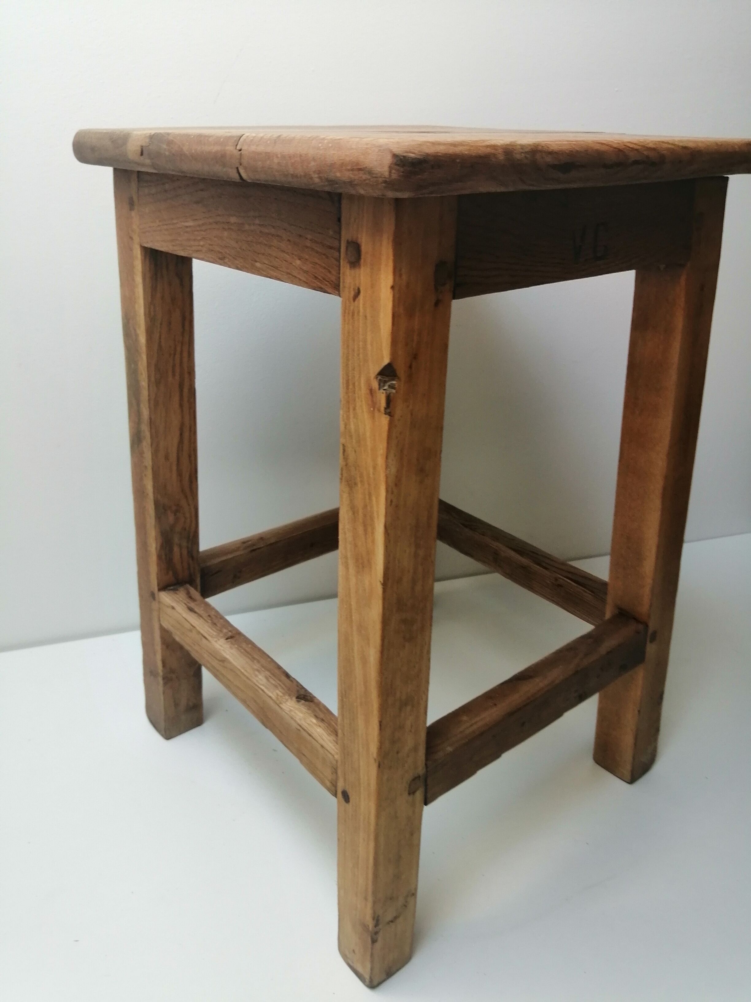 Old farm or workshop stool in oak