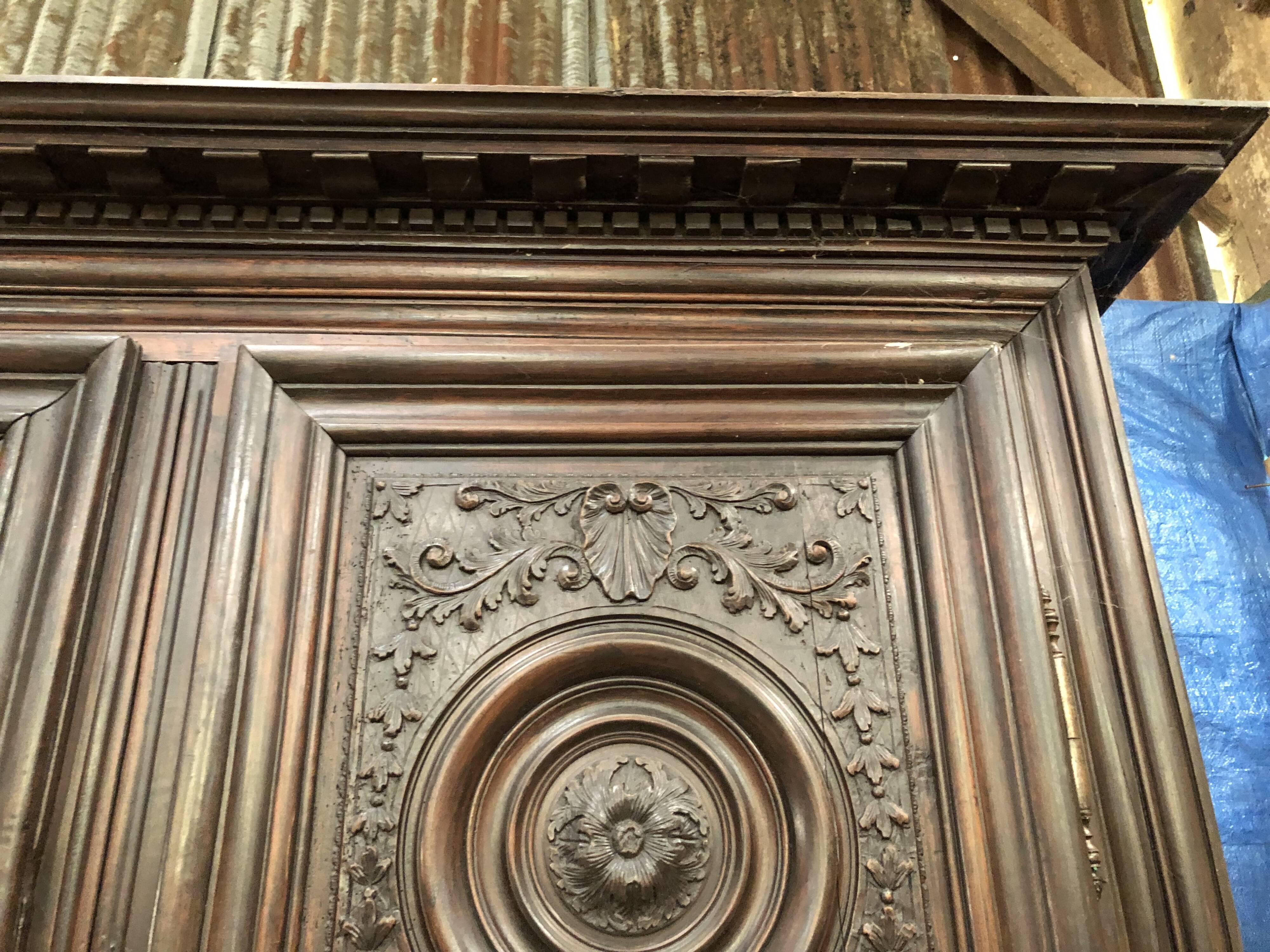 Antique Louis XIII armoire in solid walnut with carved doors