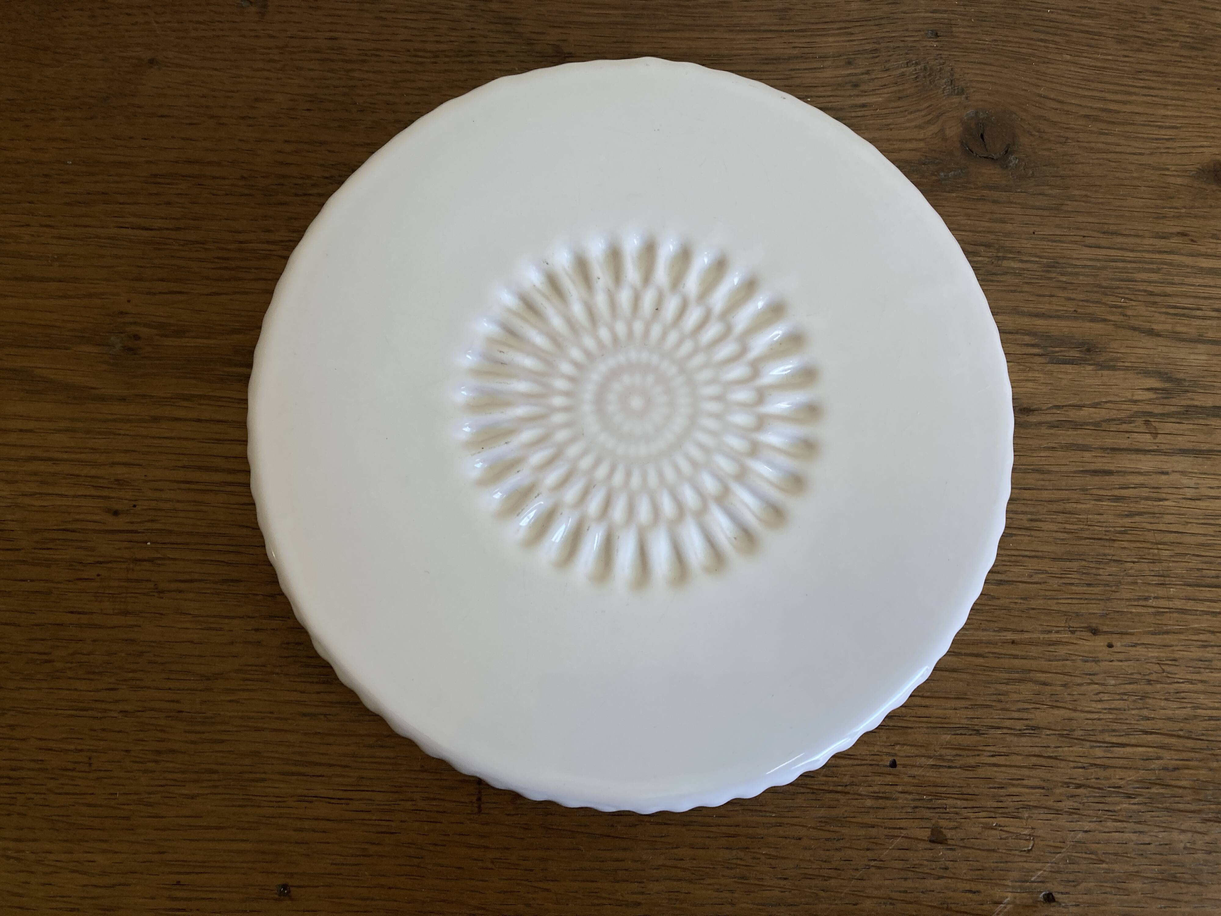 Pierre Motton glazed earthenware scalloped trivet for Gien