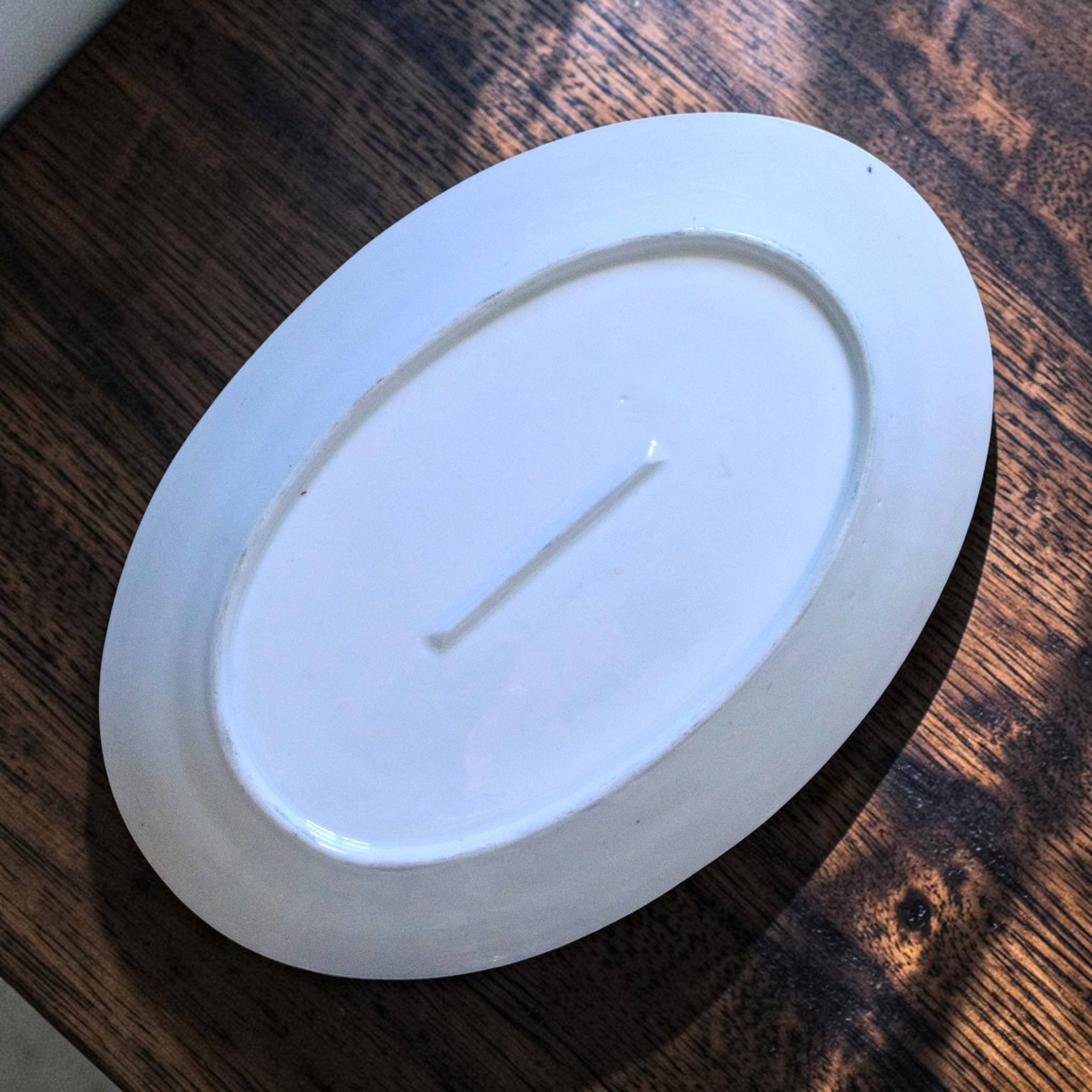 Grand plat ovale ancien de 1909 en porcelaine Oscar Schaller