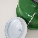 Old green kettle in enamelled metal