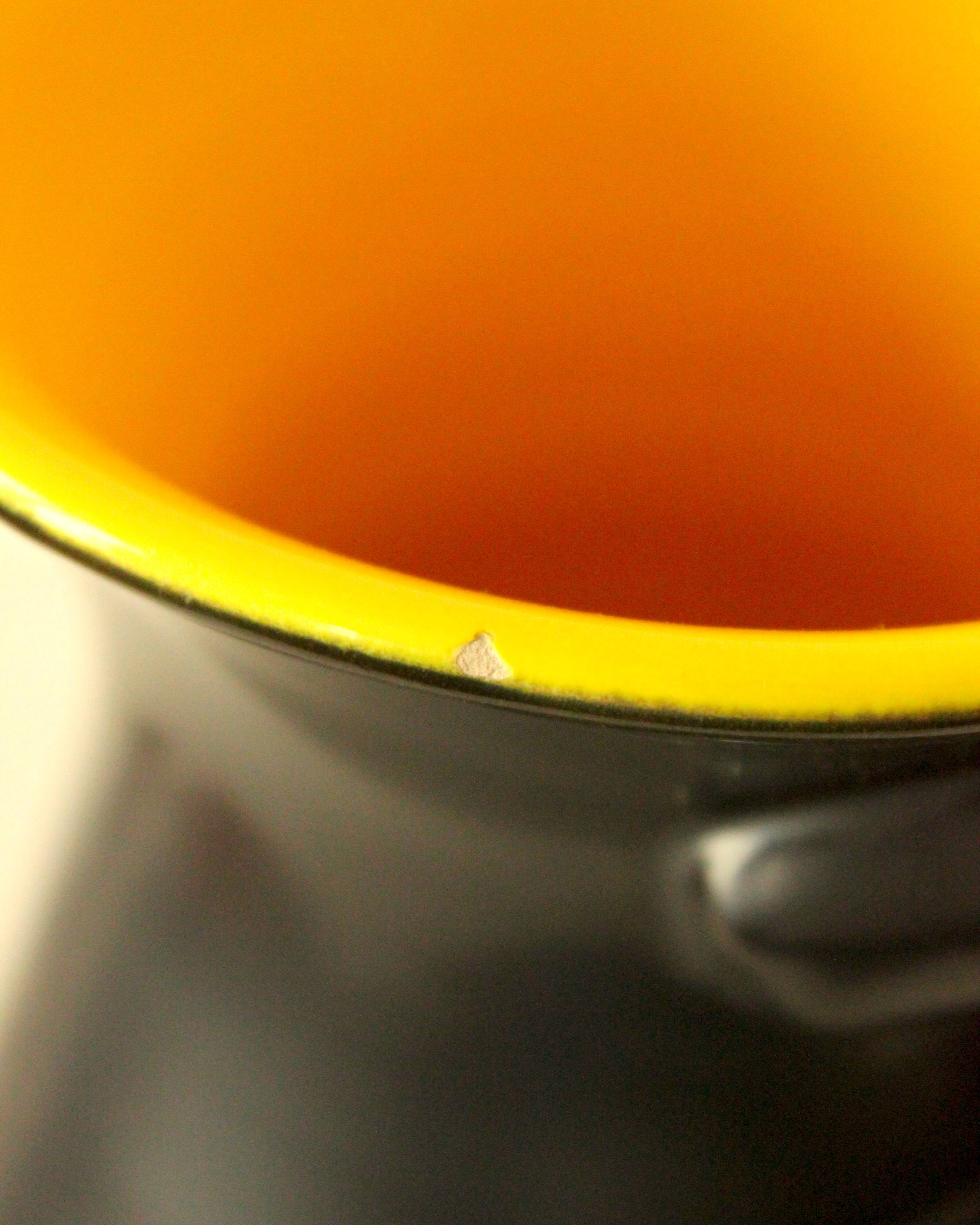 Two-handled vase, black and yellow glazed, in the style of Pol Chambost.