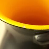 Two-handled vase, black and yellow glazed, in the style of Pol Chambost.