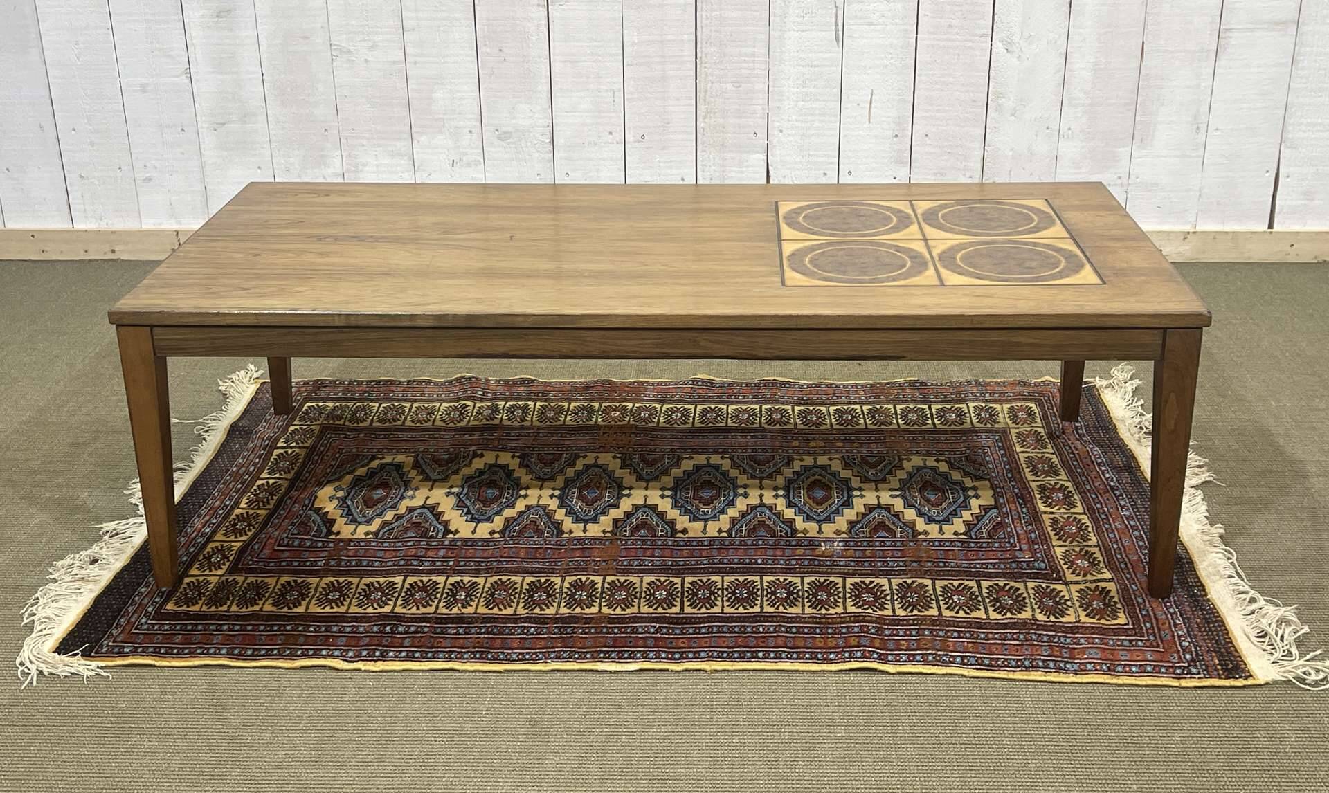 English coffee table in rosewood with tiled section from the 1970s.