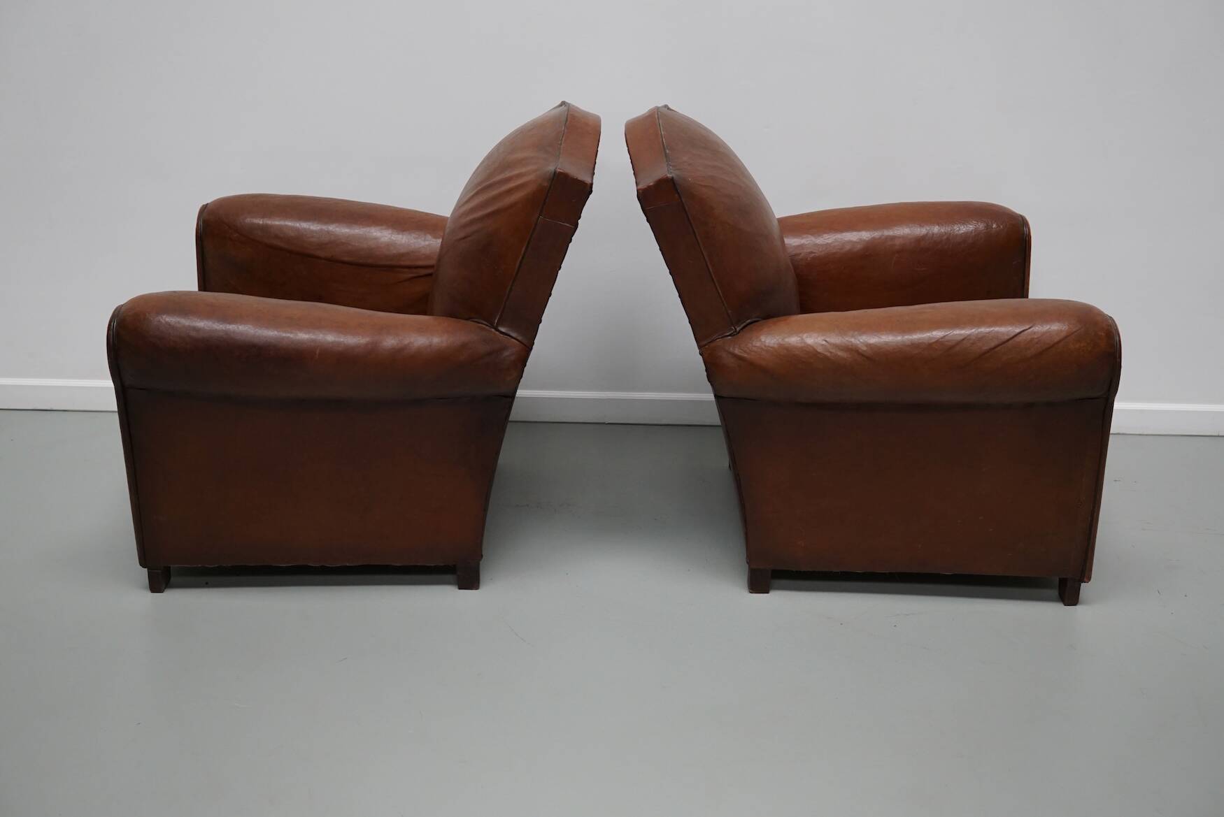 Pair of French Cognac Moustache Back Leather Club Chairs, 1940s