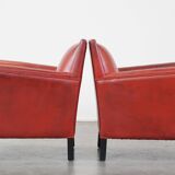 Set of 2 red-colored design armchairs made of sheepskin leather
