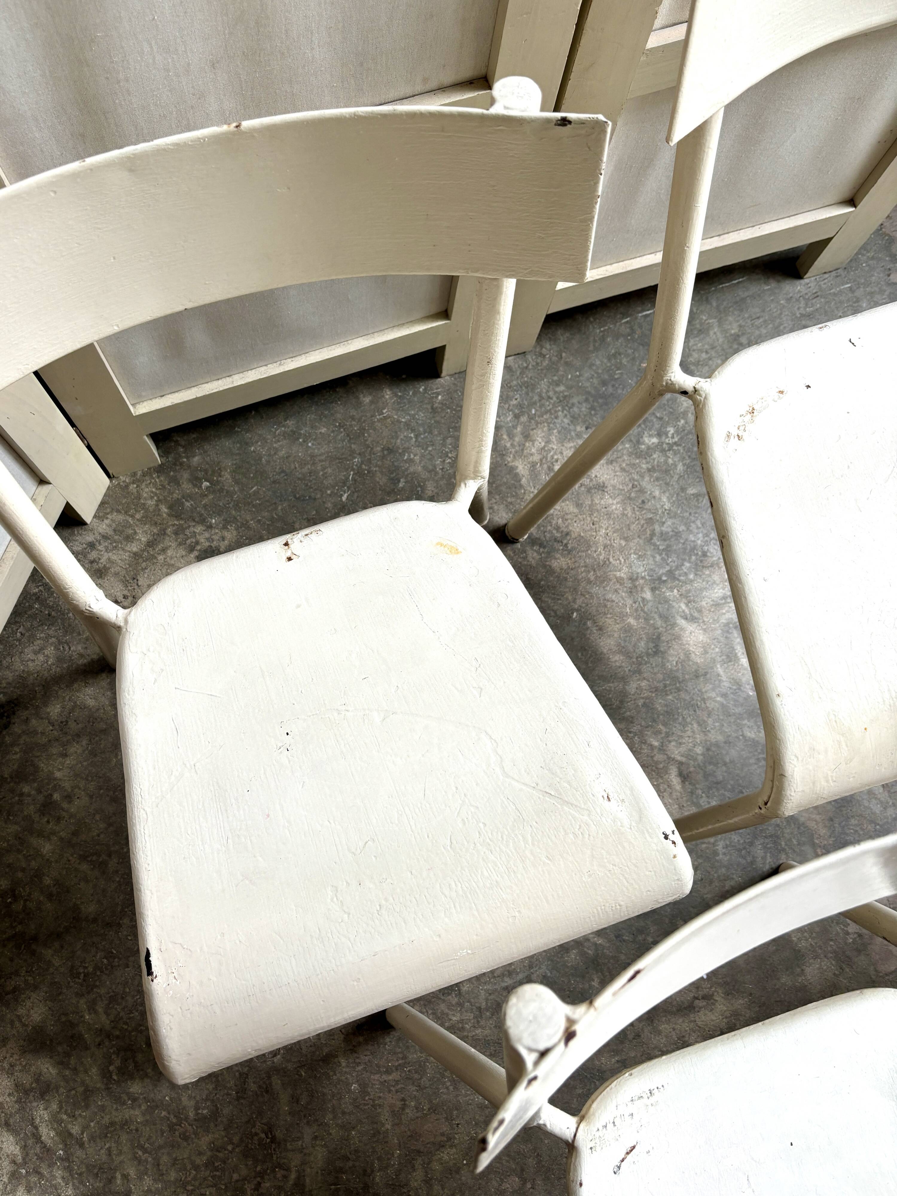 4 beige metal garden chairs