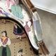 Pair of LOUIS XV-style moulded wooden shepherdesses and fabric