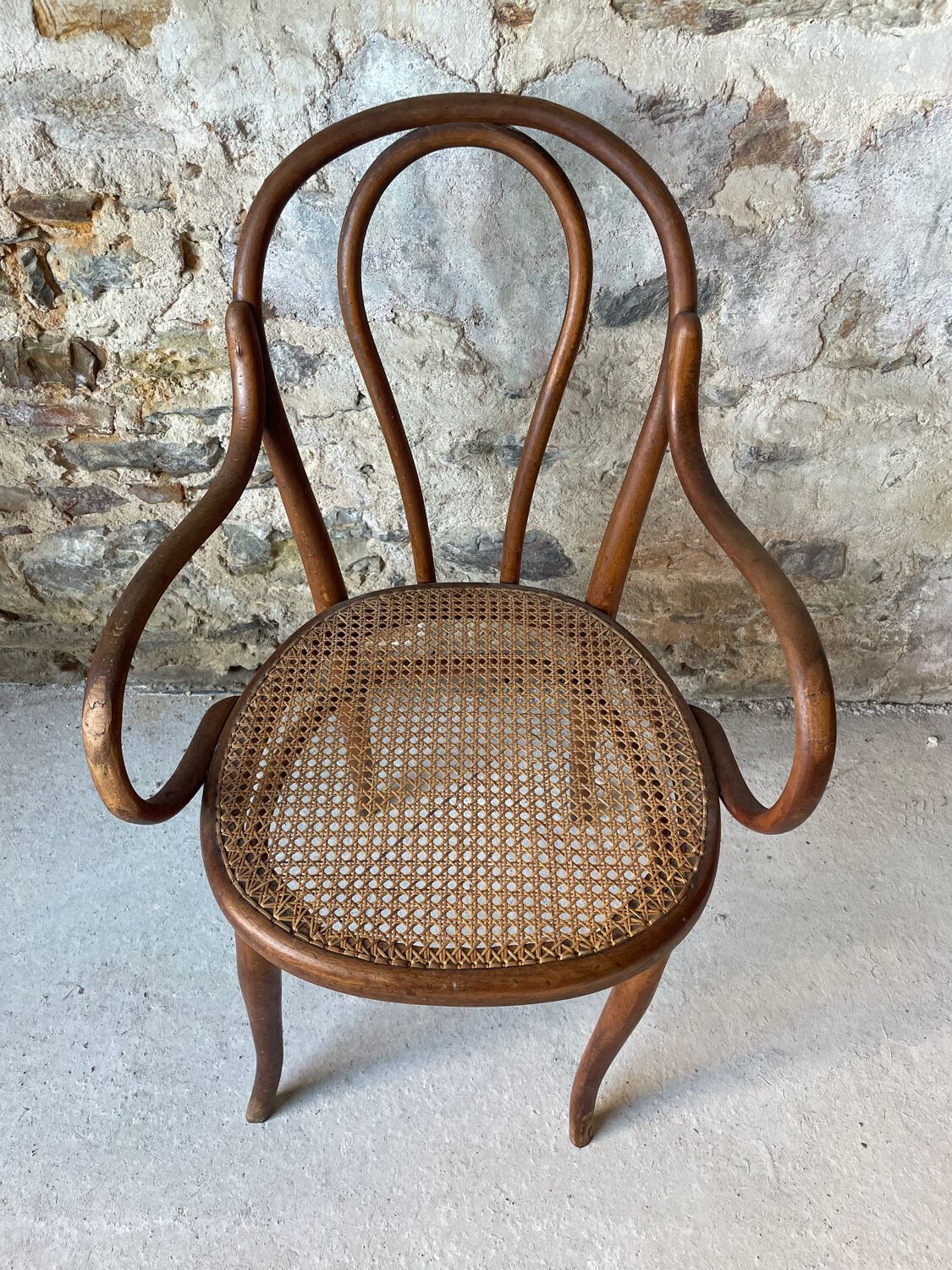 Thonet armchair with bent wood and caning