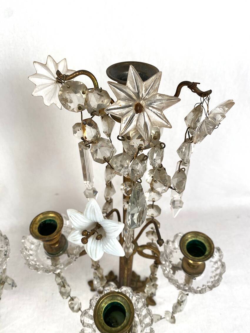 Pair of candlesticks with tassels and flowers in white porcelain