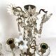 Pair of candlesticks with tassels and flowers in white porcelain