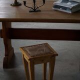 A pair of antique Danish pine stools from the late 19th century.
